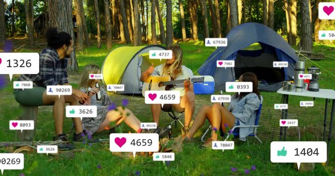 Guitarist playing for friends by fire, sparking social media bubbles growing around him