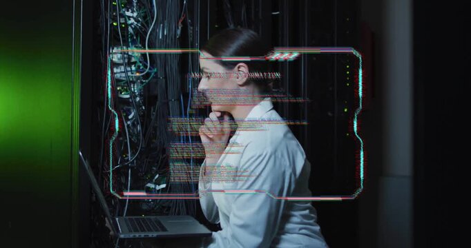 Female IT tech inspecting rack LEDs, HUD updating causing typing on laptop adjusting network cables