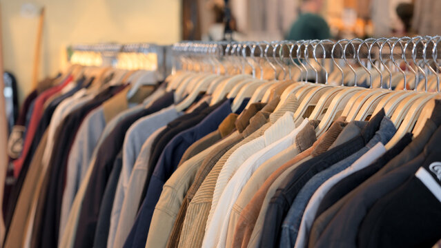 Asia flea market bazaar zero waste eco go green second hand sale store thrift old used vintage fabric retro style city small retail shop. No people shot heap of leather shoe rack shelf.