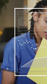 Vertical video: Tech man reading yellow folder superimposed UI overlay updating and eliciting reply
