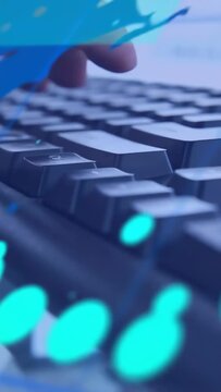 Vertical video: Right hand typing on keyboard, overlaying HUD numbers and teal dots for tech data