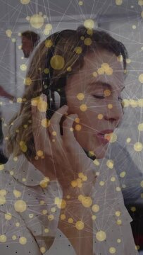 Vertical video: Phone ringing, agent putting headset, fixing mic, helping caller amid network nodes