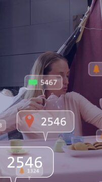 Vertical video: Mom pouring teapot into cups for kid, education AR bubbles updating counts covering