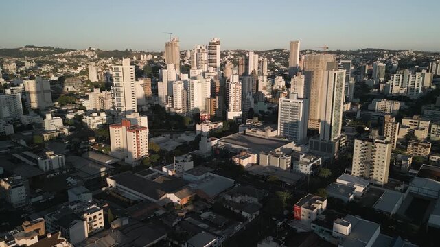 Drone footage of  buildings at sunset in downtown Chapec&oacute;.
