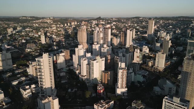 Drone footage of  buildings at sunset in downtown Chapec&oacute;.