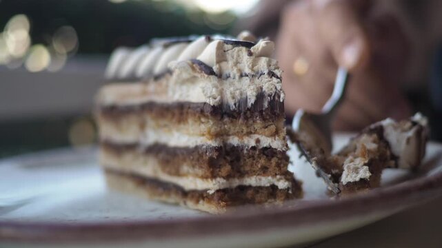 Enjoying cake in a cafe during afternoon break