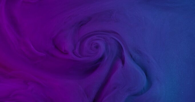 Paint steam. Dye spread. Defocused fluorescent purple blue colorful glitter splash texture cloud flow on abstract acrylic creative background.