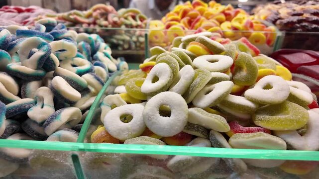 Colorful candy display at local market during daytime