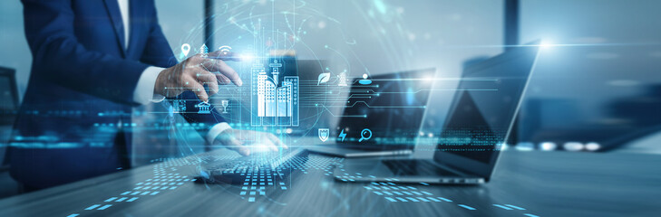 Smart Cities planner working on computer dashboards to monitor urban infrastructure. Integrated sensors and data analytics improve energy use and traffic flow for modern residents. © CyberFrame