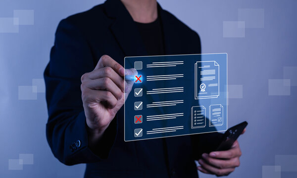 Businessman using smartphone with digital checklist interface showing approval and error marks, representing mobile audit, compliance process, quality control, inspection, validation, and  workflow