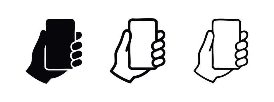 Hand holding smartphone icon set. Mobile phone in hand symbol in black, outlined, and doodle styles.