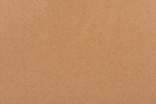 Brown kraft paper displaying a recycled material texture surface background