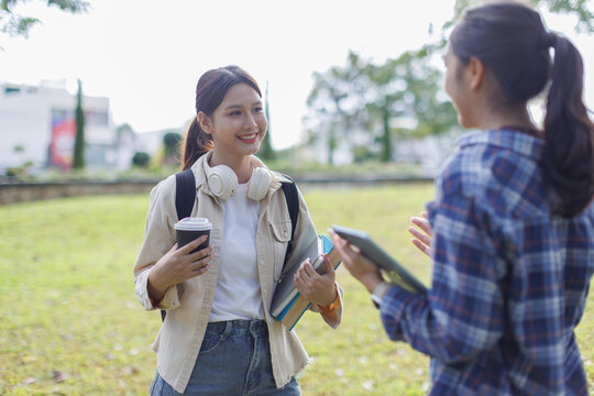 University students talking outside on campus