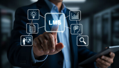 Obraz premium Businessman Touching LMS Icon for Learning Management System and Online Corporate Training