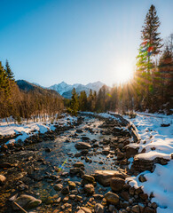 Mountain view with hiking path in Javorova dolina nature reserve during a winter sunny day in Slovakia in High Tatras mountains © Zedspider