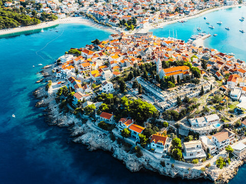 Aerial view of the historic town of Primosten on a peninsula, surrounded by crystal clear turquoise Adriatic sea, Dalmatia, Croatia.