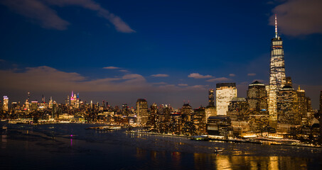NYC night cityscape. NYC skyline night panorama. New York City night skyline. NYC glowing city...