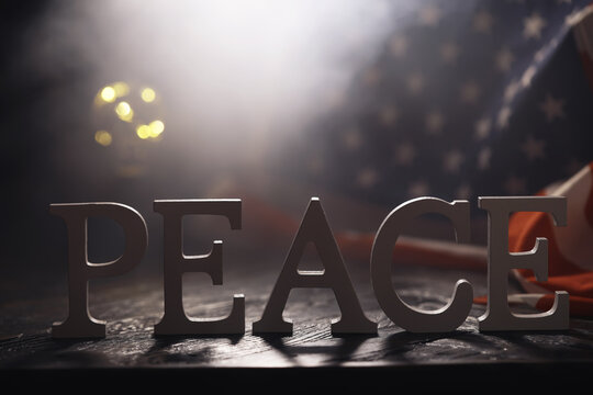 Peace Word Written In Wooden Letters. International conflict, American hegemony, War. Ukraine and Russia.