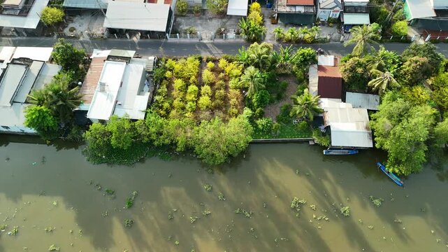 Thanh My and My Loi, Dong Thap province (Tien Giang), Mekong Delta, Vietnam: 4K aerial drone footage of canal waterways, rural houses, boats, tropical farmland and river landscape
