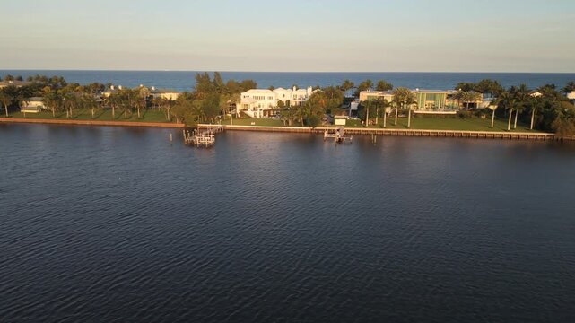 Drone flying in left to right pan near South Flagler Drive and Summa Beach Park facing east with waterfront properties in view and the Atlantic Ocean in the background.