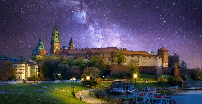 Panorama of Wawel Castle and Cathedral on the Vistula River in Krakow, Poland at night