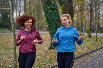 Fototapeta premium Middle aged women jogging in the park