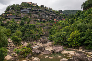 Mountain village along a rocky river gorge in Wangxian Valley, Shangrao, Jiangxi, China