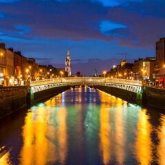 Obraz premium A serene river flows through a city at dusk with a bridge and tower