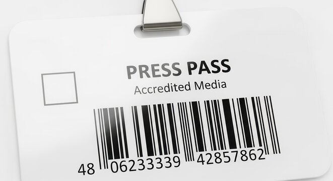 Close-up of a white plastic press pass badge featuring "Accredited Media" text and a prominent black and white barcode.