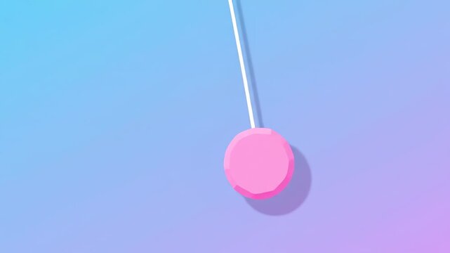 Pink Lollipop Swinging on a String Against a Gradient Background.