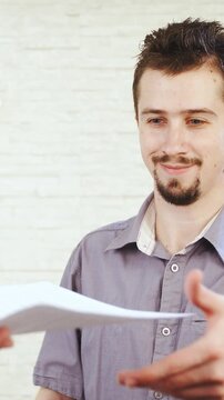 Man receive contract and tear it apart in slow motion