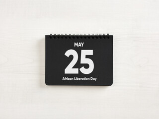 Calendar showing may 25, african liberation day, on white background