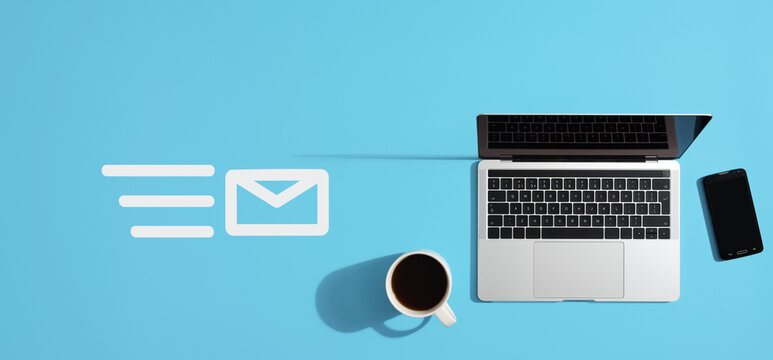 Email marketing concept with laptop and smartphone on blue background