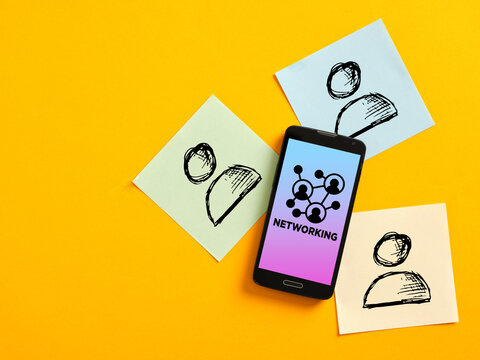 Smartphone showing networking concept surrounded by contacts on sticky notes