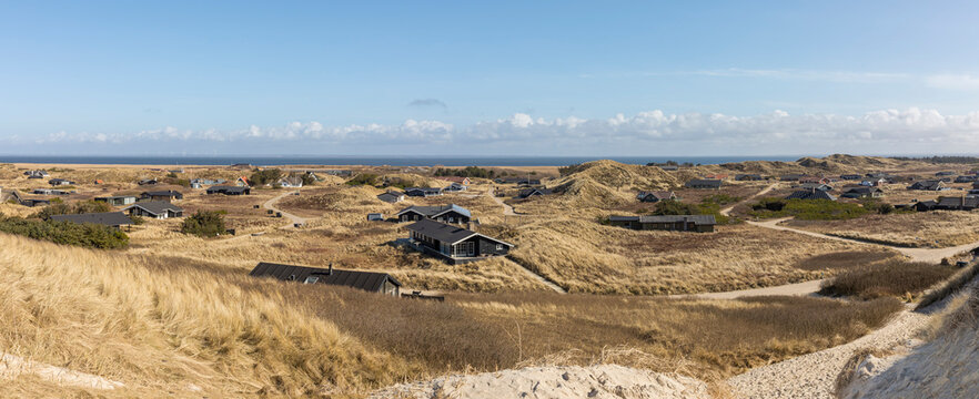Panorama of holiday homes settlement at &Aring;rgab, Holmsklit, Denmark. Ringk&oslash;bing Fjord in background, view from a North Sea dune