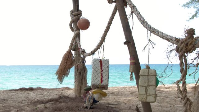 Fishing Floats and Ropes Hanging on a Tropical Phuket Beach