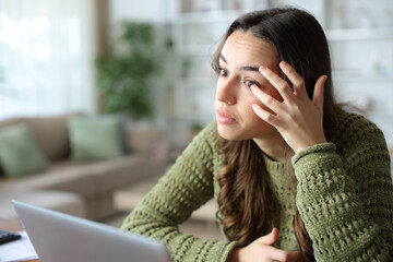 Woman at home repositioning contact lenses