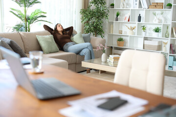 Tele worker taking a break and resting while working at home