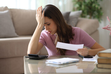 Worried woman complaining accounting at home