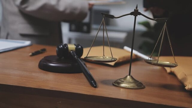 Law theme, mallet of the judge, law enforcement officers, evidence-based cases and documents taken into account.