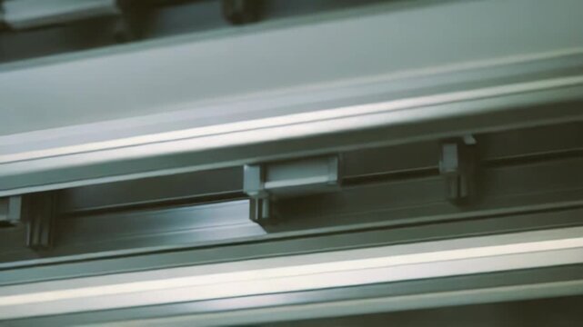 Aluminum profiles forming an abstract pattern, showcasing advanced engineering and modern industrial design in a detailed close up of structural components and sleek metal bars