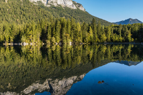 Idyllic Hintersee lake with small islands and Hochkalter mountain in Berchtesgaden Alps in Ramsau with Zauberwald Forest