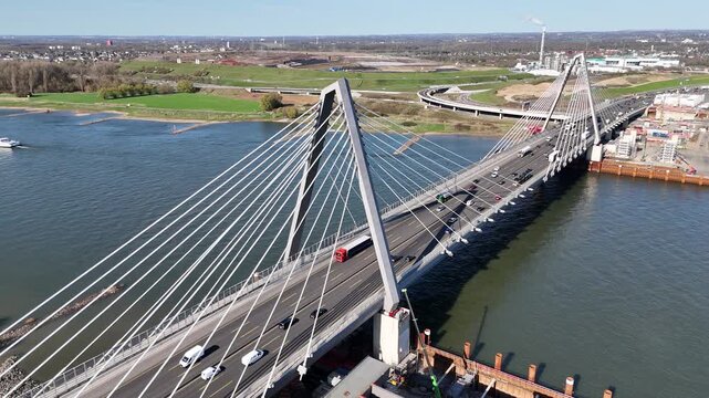 Drone holds position showing full bridge and distant shoreline
