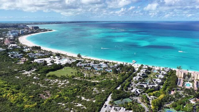 Grace Bay At Turks And Caicos In Overseas Territory United Kingdom. Caribbean Skyline. Beach Landscape. Highrise Buildings. Grace Bay In United Kingdom. Nature Background