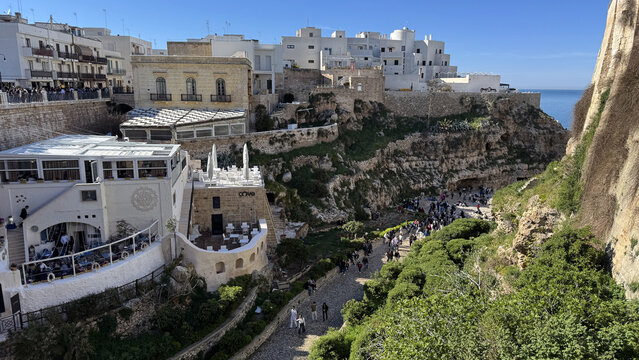 Polignano a Mare Lama Monachile cliff with beach and historic buildings Puglia Italy