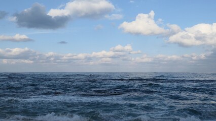 Fototapeta premium Waves and Cloudy Sky at Sacheonjin Beach, Gangneung