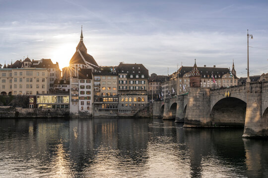 Basel old city and Martinskirche church at sunset by the river Rhine