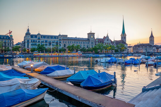 Zurich cityscape with Limmat river and Fraum�nster church at blue hour