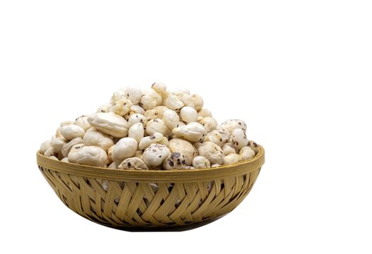 Makhana or Fox Nut in a Bamboo Basket Isolated on White Background with Copy Space, Also Known as Lotus Seed Pop, Euryale Ferox or Gorgon Nut, Healthy Eating Food and Snack