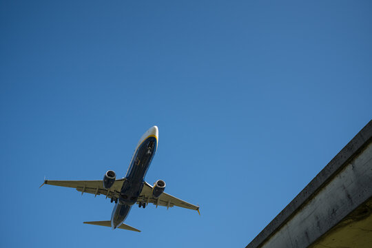 Bergamo, Italy - April 6, 2026: Dynamic shot of a commercial airplane landing at Orio al Serio Airport (BGY) in Bergamo, Italy, on a bright and sunny spring day